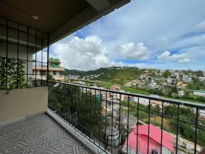 a balcony with a view of a city at Cafe Sola bnb in Shillong