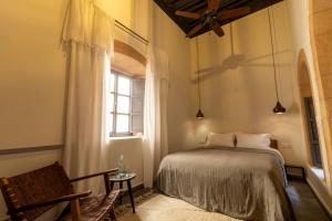 Postel nebo postele na pokoji v ubytování Maison 250 - Adult Only