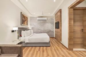 Voodi või voodid majutusasutuse Country Inn Ayodhya - opposite airport toas