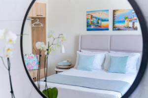 Posteľ alebo postele v izbe v ubytovaní Hotel ASTERA