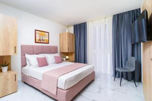 Posteľ alebo postele v izbe v ubytovaní Hotel ASTERA