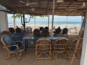 a group of chairs and a table on the beach at Omkar Beach Bungalow in Agonda +30 photos