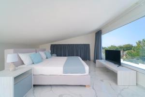 Posteľ alebo postele v izbe v ubytovaní Hotel ASTERA
