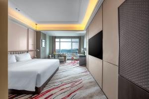 Postel nebo postele na pokoji v ubytování Mövenpick by Accor Xuzhou
