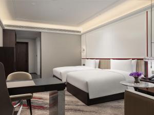 Postel nebo postele na pokoji v ubytování Mövenpick by Accor Xuzhou