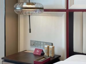 Postel nebo postele na pokoji v ubytování Mövenpick by Accor Xuzhou