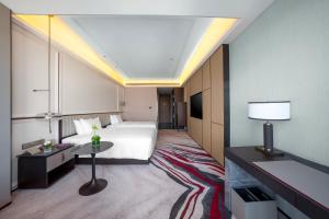 Postel nebo postele na pokoji v ubytování Mövenpick by Accor Xuzhou