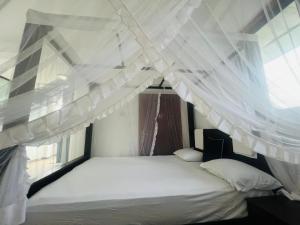 Letto o letti in una camera di Shanika Beach Inn