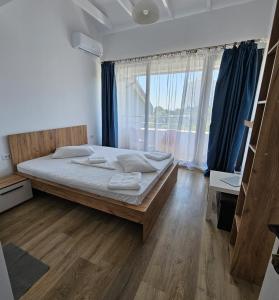 Postel nebo postele na pokoji v ubytování Vila Ayra