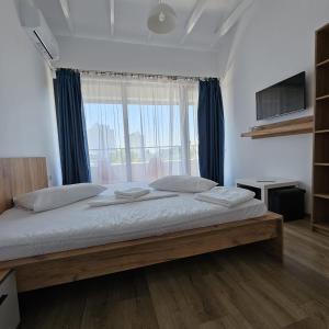 Postel nebo postele na pokoji v ubytování Vila Ayra