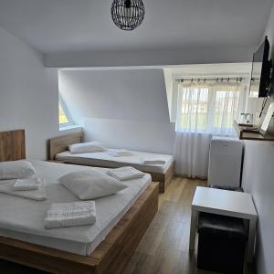 Postel nebo postele na pokoji v ubytování Vila Ayra