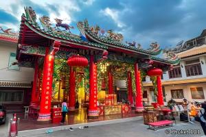 a temple in a city with red columns at XX Hidden Dragon Yaowarat Road ถนนเยาวราช in Samphanthawong