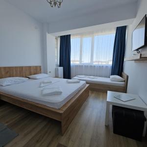 Postel nebo postele na pokoji v ubytování Vila Ayra