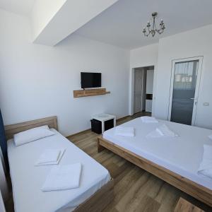 Postel nebo postele na pokoji v ubytování Vila Ayra