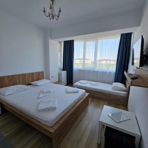 Postel nebo postele na pokoji v ubytování Vila Ayra