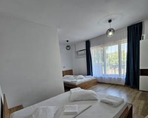 Postel nebo postele na pokoji v ubytování Vila Ayra