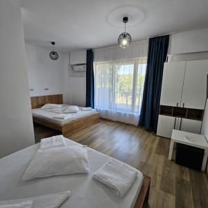 Postel nebo postele na pokoji v ubytování Vila Ayra