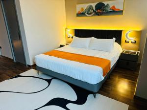 Postel nebo postele na pokoji v ubytování Hotel Royal