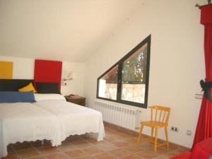 A bed or beds in a room at Casa Rural 3 en un fantástico legado