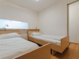 Postel nebo postele na pokoji v ubytování Apartment Haus Achenstrasse-2 by Interhome