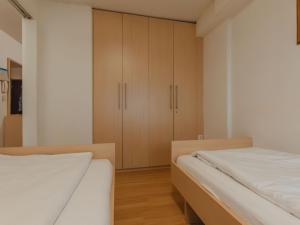 Postel nebo postele na pokoji v ubytování Apartment Haus Achenstrasse-2 by Interhome