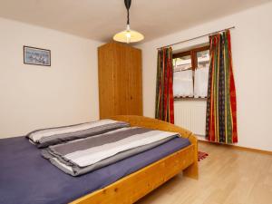 Łóżko lub łóżka w pokoju w obiekcie Holiday Home Schwarzenegg by Interhome