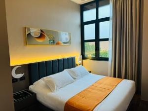 Postel nebo postele na pokoji v ubytování Hotel Royal