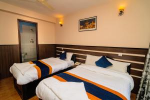 Ένα ή περισσότερα κρεβάτια σε δωμάτιο στο Karma Travellers Home