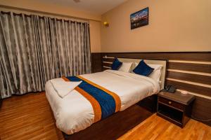Ένα ή περισσότερα κρεβάτια σε δωμάτιο στο Karma Travellers Home