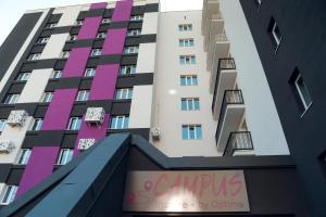 a building with pink and purple paint on it at Campus Inspire Хмельницький in Khmelnytskyi