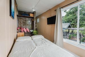 Postel nebo postele na pokoji v ubytování Ronnys Flat Manuel Antonio