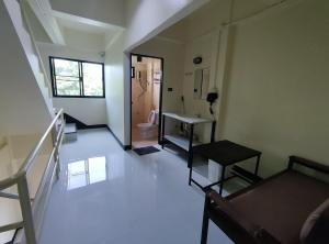 a bathroom with a sink and a toilet in a room at 168 Chiangmai Guesthouse in Chiang Mai