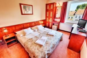 Posteľ alebo postele v izbe v ubytovaní Hotel Irottkö