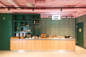 a kitchen with a counter and a sign that readscial mixer at Conscious Hotel Vondelpark in Amsterdam +28 photos