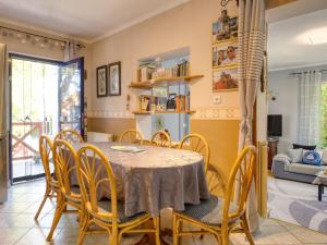 a dining room with a table and chairs at Holiday Home Emöke by Interhome in Balatonederics