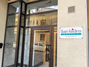 a sign on a glass door of a building at Hostal San Isidro in Autol