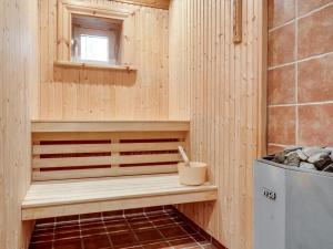 a wooden sauna with a bench and a window at Holiday Home Nedre Gärdsjö by Interhome in Rättvik