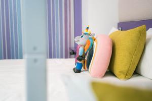 Postel nebo postele na pokoji v ubytování Hotel Magic Fantasy