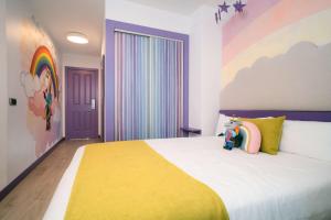 Postel nebo postele na pokoji v ubytování Hotel Magic Fantasy