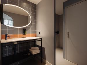Een badkamer bij Conscious Hotel Museum Square