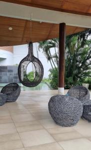 a group of chairs sitting under a pavilion at Apartment Karon SeaView 72 sq in Karon Beach