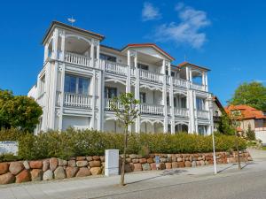 a large white building with a large balcony at Villa Annika - Apt. 08 in Ostseebad Sellin