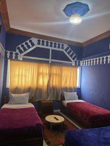 Postel nebo postele na pokoji v ubytování Taghadoute Hotel