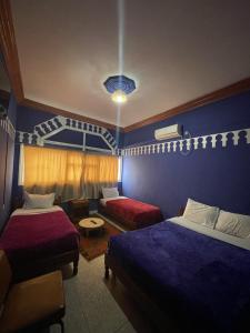 Postel nebo postele na pokoji v ubytování Taghadoute Hotel