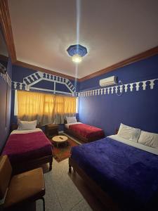 Postel nebo postele na pokoji v ubytování Taghadoute Hotel