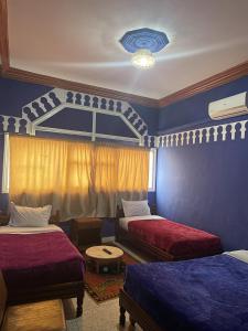 Postel nebo postele na pokoji v ubytování Taghadoute Hotel