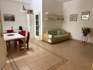 a living room with a couch and a table at Casachiara in Viareggio
