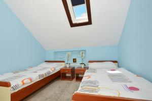 Posteľ alebo postele v izbe v ubytovaní Apartment Irvin