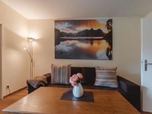 a living room with a couch and a table at Apartment Schlossalmblick by Interhome in Bad Hofgastein