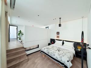 Postel nebo postele na pokoji v ubytování 山田心精品民宿 Valley Heart Inn